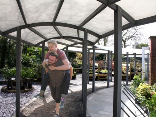 Perks of Write Good! employment: human-powered transportation.  Summer intern carries senior vowel engineer through Write Good Hall of Be Quiet.